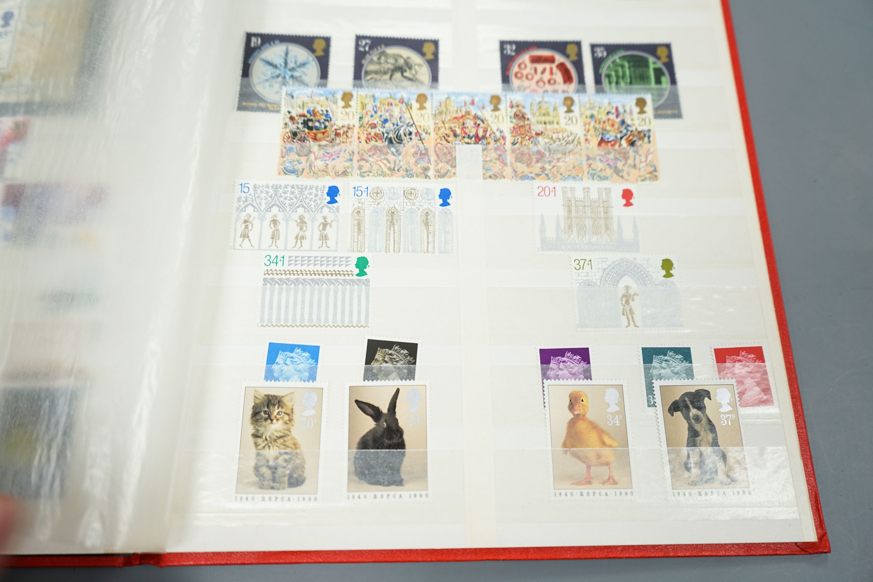 A blue album of George V mounted mint British Commonwealth stamps, one other album and two stock books (4)